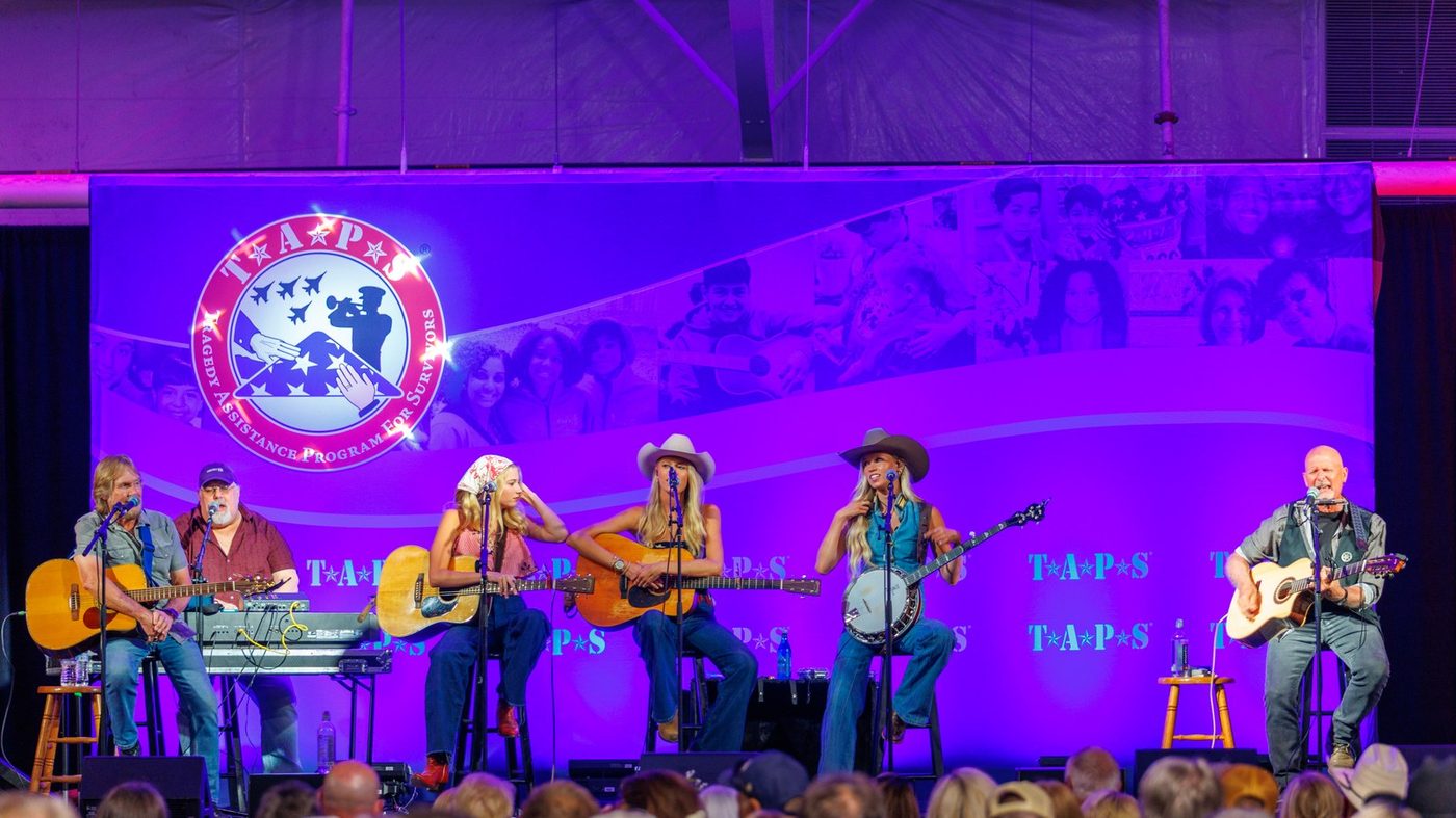 Performers seated in-the-round on the TAPS stage